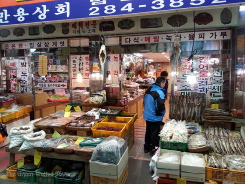 This shop sells a bunch of everything. The signs advertise dried persimmons, buckwheat, deer antler, green tea, etc.
