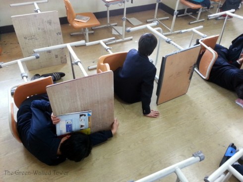 I like that this kid still seems to be reading his English book down there.